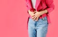 Stomach ache. Woman holds hands stomach. Menstrual pain or bowel problems