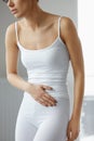 Stomach Health. Closeup Of Beautiful Female Body Feeling Pain Royalty Free Stock Photo