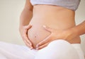 Stomach, love or hands of pregnant woman with belly growth, care or maternal bond closeup. Future mother, zoom or