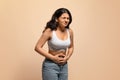 Stomach Pain. Sick young indian woman suffering from acute abdominal ache Royalty Free Stock Photo