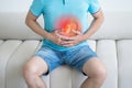 Stomach ulcer, man with abdominal pain suffering at home, symptoms of gastritis, diseases of the digestive system