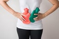 Stomachache,Abdominal surface,Woman hand using hot water bag or bottle on her belly on bedroom Royalty Free Stock Photo