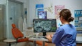 Stomatological nurse inviting patient in dental room