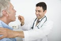 Stomatologist Checking Patient's Throat