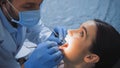 stomatologist in medical mask examining teeth