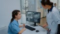 Stomatologist and nurse examining dental x ray scan Royalty Free Stock Photo