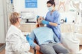 Stomatologist nurse putting oxigen mask before tooth surgery