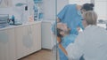 Stomatologist and nurse using dental tools to examine dentition work