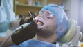 Stomatology healthcare - male patient at dentist`s chair