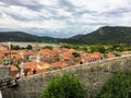 A group of tourists taking photos along the Walls of Ston, in the ancient town of Ston, Croatia.