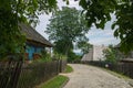 Stone alley in Shevchenko`s grove near a blue wooden house