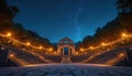 Stone amphitheater with illuminated arches and string lights under a starry night sky. Rich trees surround the ancient structure Royalty Free Stock Photo