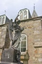 Stone angel on the old graveyard of the former church of Moulin, near Pitlochry, Scotland.