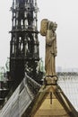 Stone angel on the roof of Notre-Dame of Paris cathedral France Royalty Free Stock Photo