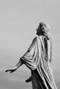 Stone angel statue with missing wings on historic cemetery Royalty Free Stock Photo