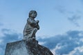 Stone angel statue praying at the cemetery `Cementerio General` in Merida, Yucatan, Mexico
