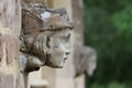 Stone angel woman gargoyle sculpture at church entrance Royalty Free Stock Photo