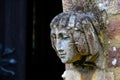 Stone angel woman gargoyle sculpture at church entrance Royalty Free Stock Photo