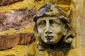 Stone angel woman gargoyle sculpture at church entrance Royalty Free Stock Photo