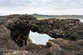 stone arch on Atlantic ocean coas in Iceland Royalty Free Stock Photo