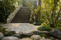 Stone arch bridge in woods at sunny winter noon Royalty Free Stock Photo