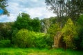 Stone arch entrance the garden. Lush green of foliage Royalty Free Stock Photo