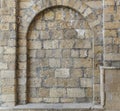 Stone arch lined with large bricks