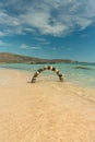 Stone arch made of pebbles on the beach Royalty Free Stock Photo