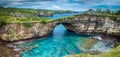 Stone arch over the sea. Broken beach, Nusa Penida , Indonesia. Royalty Free Stock Photo