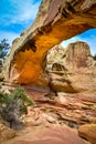 Stone arch under a trail walk in the Capitol reef National Park, Utah USA Royalty Free Stock Photo