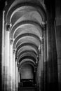 Stone arches in a church aisle Royalty Free Stock Photo