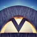 letter V at sun rise by the sea