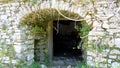 Stone archway, entrance to storeroom - Old Perithia, Corfu Royalty Free Stock Photo
