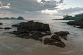 Stone as forground and beach as background in sunset. Remote Island in Thailand. Royalty Free Stock Photo