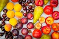 Stone Autumn fruit on the wooden table, flat view. Royalty Free Stock Photo