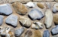 Stone background in gray, brown, orange and blue hues Royalty Free Stock Photo