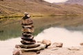 Stone balance on a high mountain lake in Himalaya