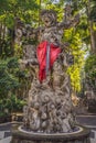 Stone balinese statue with green lush valley on the background. Bali island, Indonesia