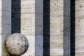 Stone ball in front of a row of columns Royalty Free Stock Photo