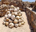 Stone balls for  catapult from the time of the Crusades in the fortress of the Crusaders in the Apollonia National Park in Israel Royalty Free Stock Photo