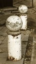 Stone balls on a city street. Urban design fencing road. Large outdoor decorative large cracks from natural granite spheres.