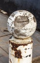 Stone balls on a city street. Urban design fencing road. Large outdoor decorative large cracks from natural granite spheres.