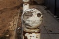 Stone balls on a city street. Urban design fencing road. Large outdoor decorative large cracks from natural granite spheres.