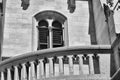 Stone balustrade balcony railing and arched window in Gothic style facade Royalty Free Stock Photo