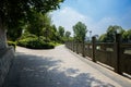 Stone balustraded riverside in city at sunny summer noon