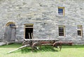Shaker Round Stone Barn, wagon, windows and door Royalty Free Stock Photo