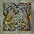 Stone bas-relief of a griffin of a mythological winged creature with the body of a lion and the head of an eagle on the castles of