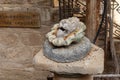 The stone bas-relief of a lions head in the courtyard of the Monastery Deir Hijleh - Monastery of Gerasim of Jordan, in the