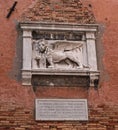 Stone bas-relief of the Venetian lion on the wall of the Arsenal of Venice. The lion of St. Mark is a symbol of the city Royalty Free Stock Photo