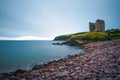 Stone beach and the Minard Castle situated on the Dingle Peninsula in Ireland Royalty Free Stock Photo